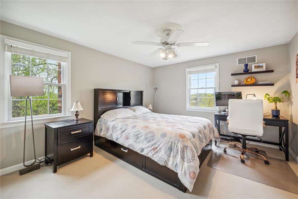 2336 Mill Grove Road Pittsburgh, PA 15241 - Photo 23 of 44 a bedroom with a bed a table and a chandelier