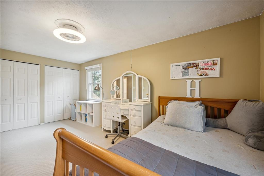 2336 Mill Grove Road Pittsburgh, PA 15241 - Photo 25 of 44 a bedroom with a bed and a table chair