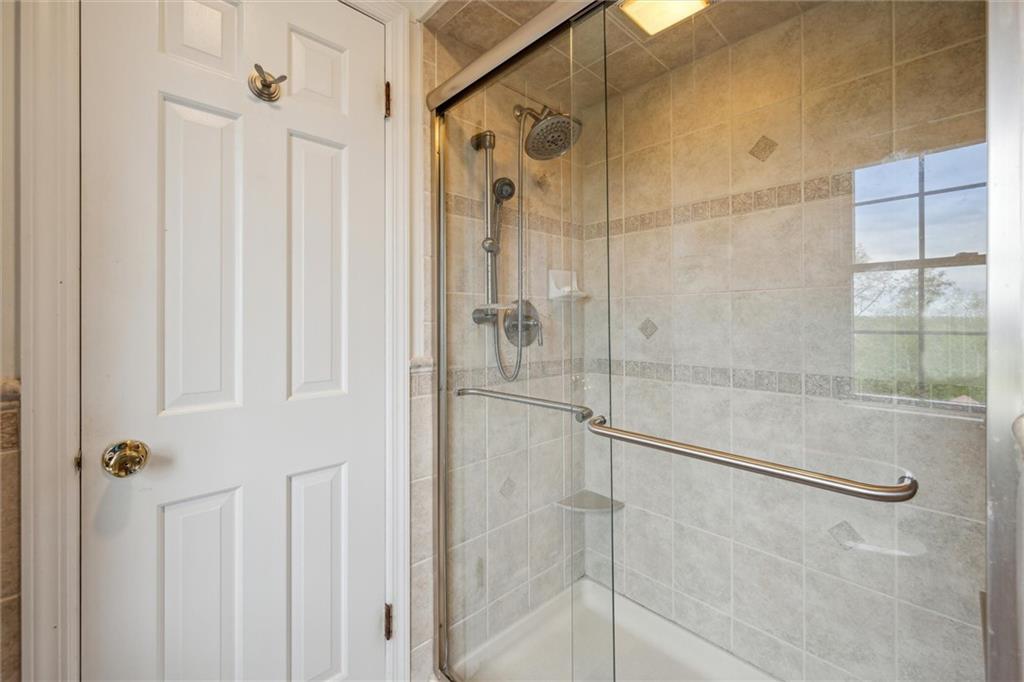 2336 Mill Grove Road Pittsburgh, PA 15241 - Photo 29 of 44 a bathroom with a glass shower door