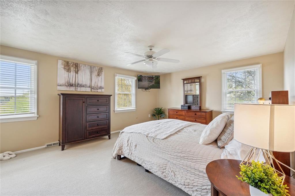 2336 Mill Grove Road Pittsburgh, PA 15241 - Photo 30 of 44 a bed sitting in a spacious bedroom next to a window