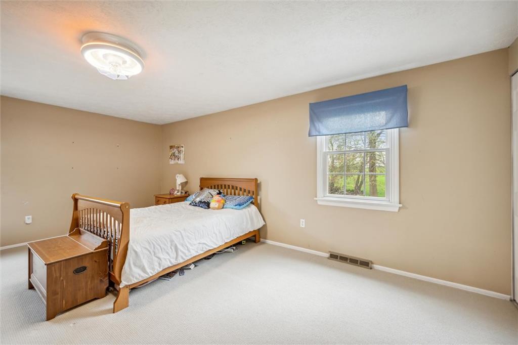 2336 Mill Grove Road Pittsburgh, PA 15241 - Photo 33 of 44 a bed room with a bed and a window