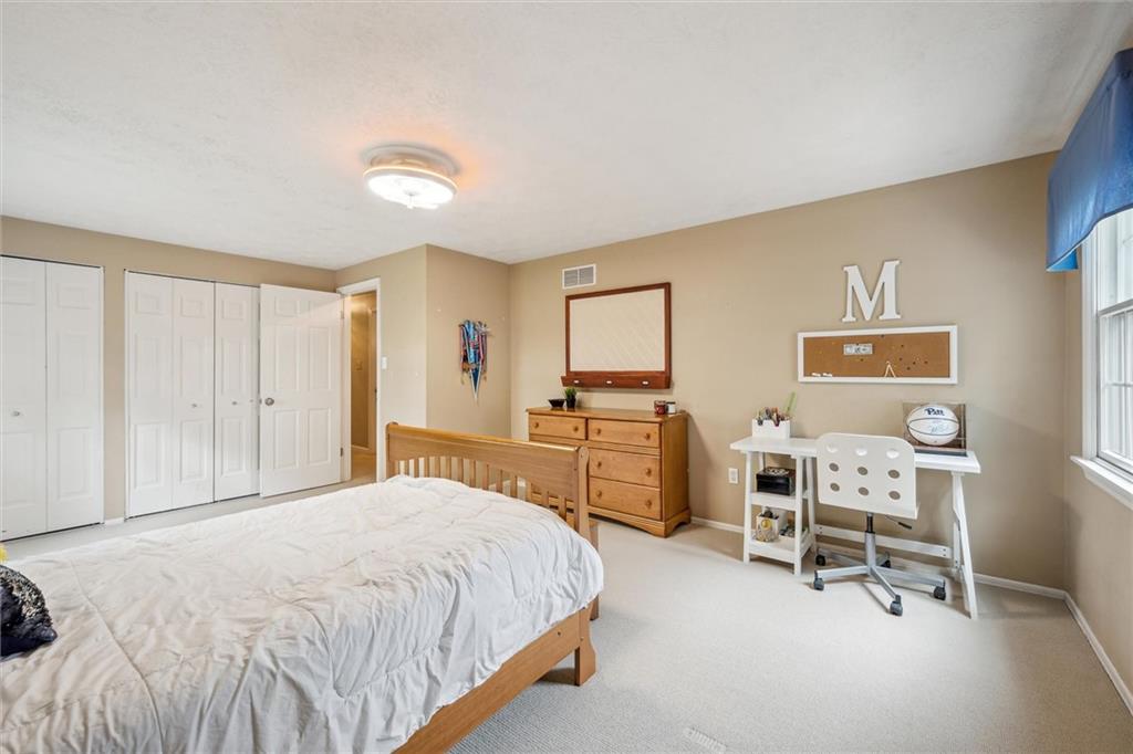 2336 Mill Grove Road Pittsburgh, PA 15241 - Photo 34 of 44 a spacious bedroom with a bed and a furniture