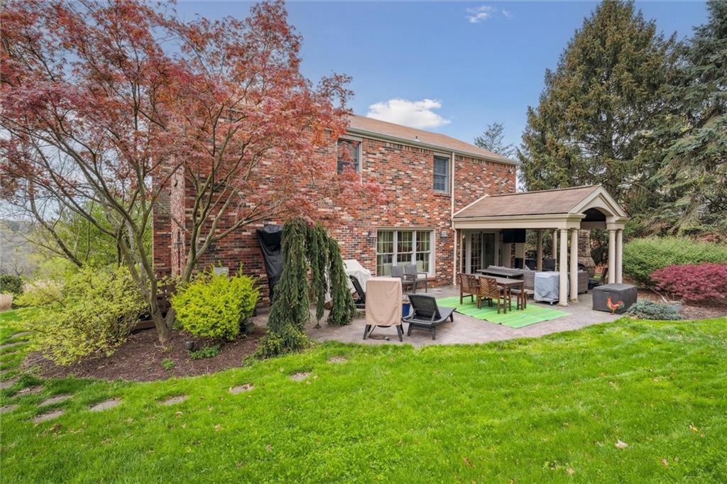 2336 Mill Grove Road Pittsburgh, PA 15241 - Photo 42 of 44 a view of a patio with table and chairs and potted plants with large tree