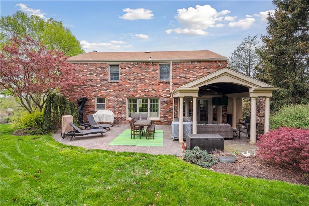 2336 Mill Grove Road Pittsburgh, PA 15241 - Photo 43 of 44 a view of a chair and table in backyard of the house