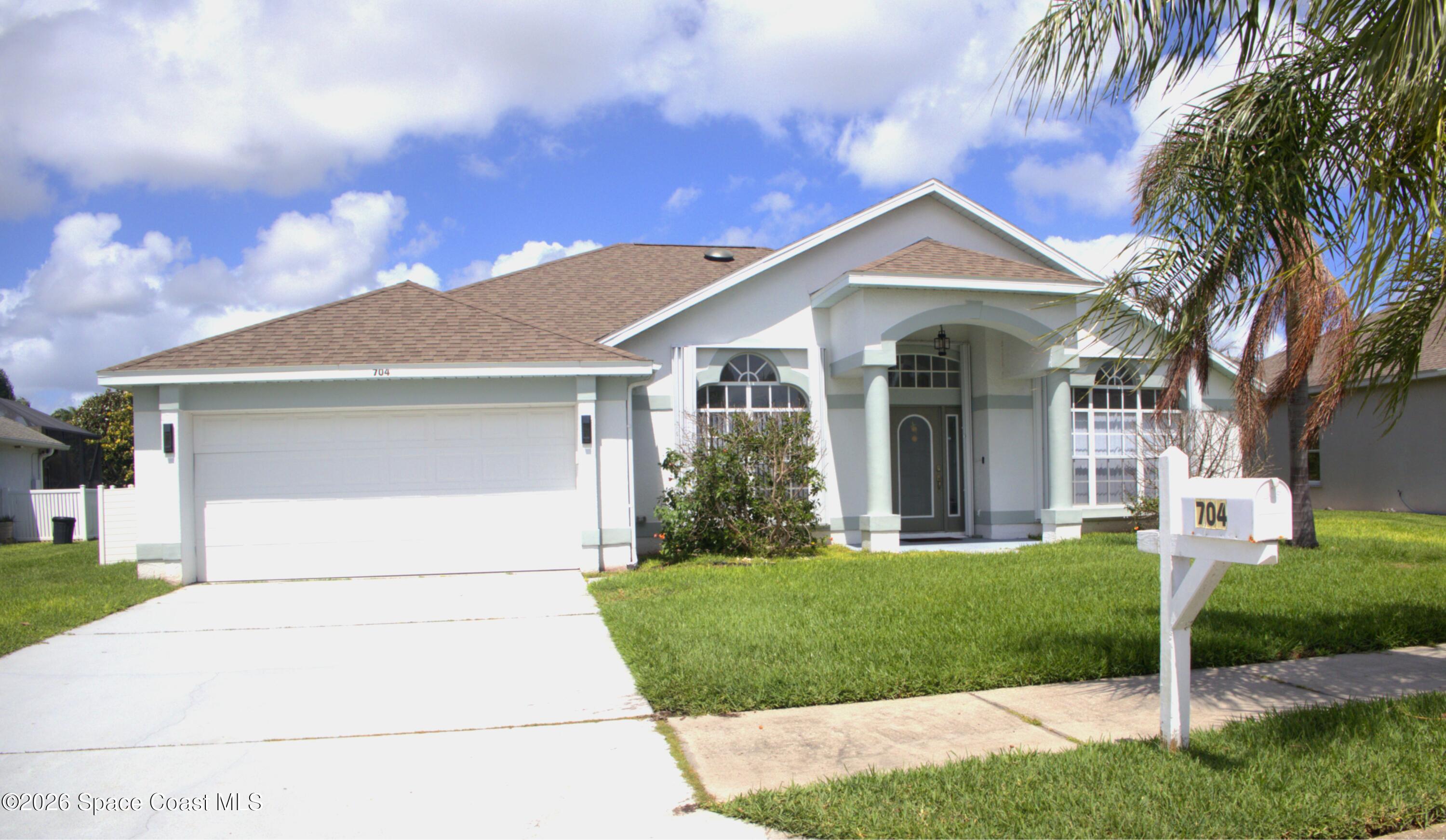 704 Carriage Hill Road Melbourne, FL 32940 - Photo 1 of 59 Front