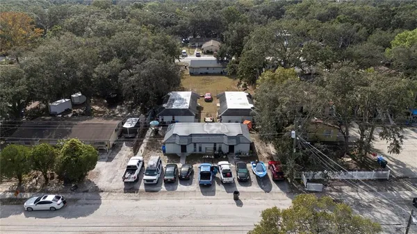 an aerial view of a house with outdoor space