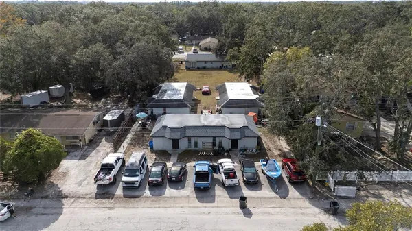a view of a patio with table and chairs and potted plants
