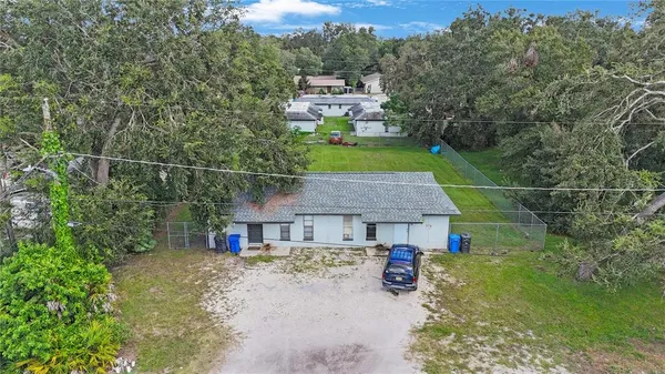 a aerial view of a house with swimming pool and garden