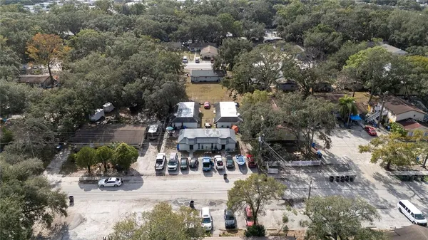 an aerial view of a house with outdoor space