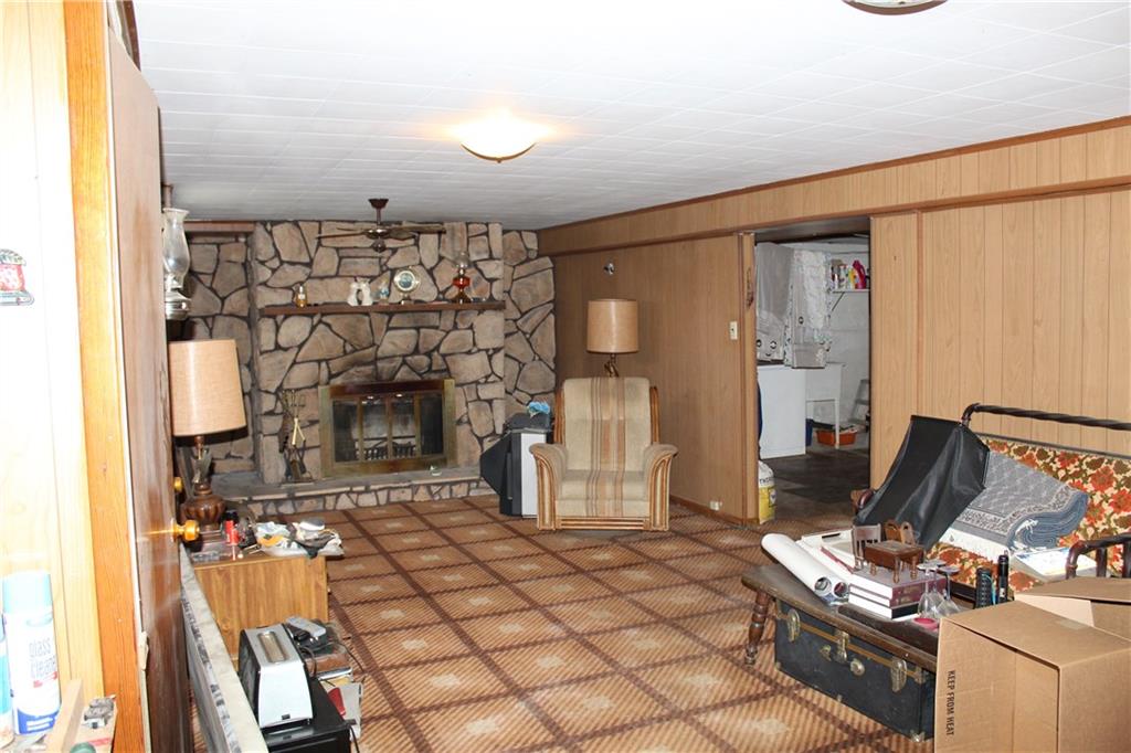 3815 Henderson Road Hickory, PA 15340 - Photo 20 of 21 Lower level with a wood buring fireplace