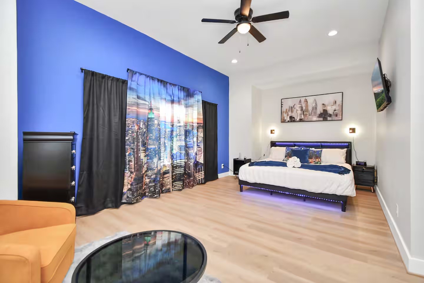 5718 Beall Street, Unit D Houston, TX 77091 - Photo 12 of 41 a spacious bedroom with a bed and a chandelier