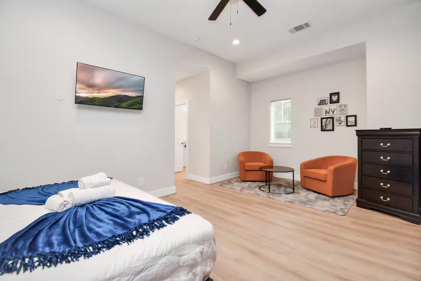 5718 Beall Street, Unit D Houston, TX 77091 - Photo 14 of 41 a bedroom with a bed and dresser