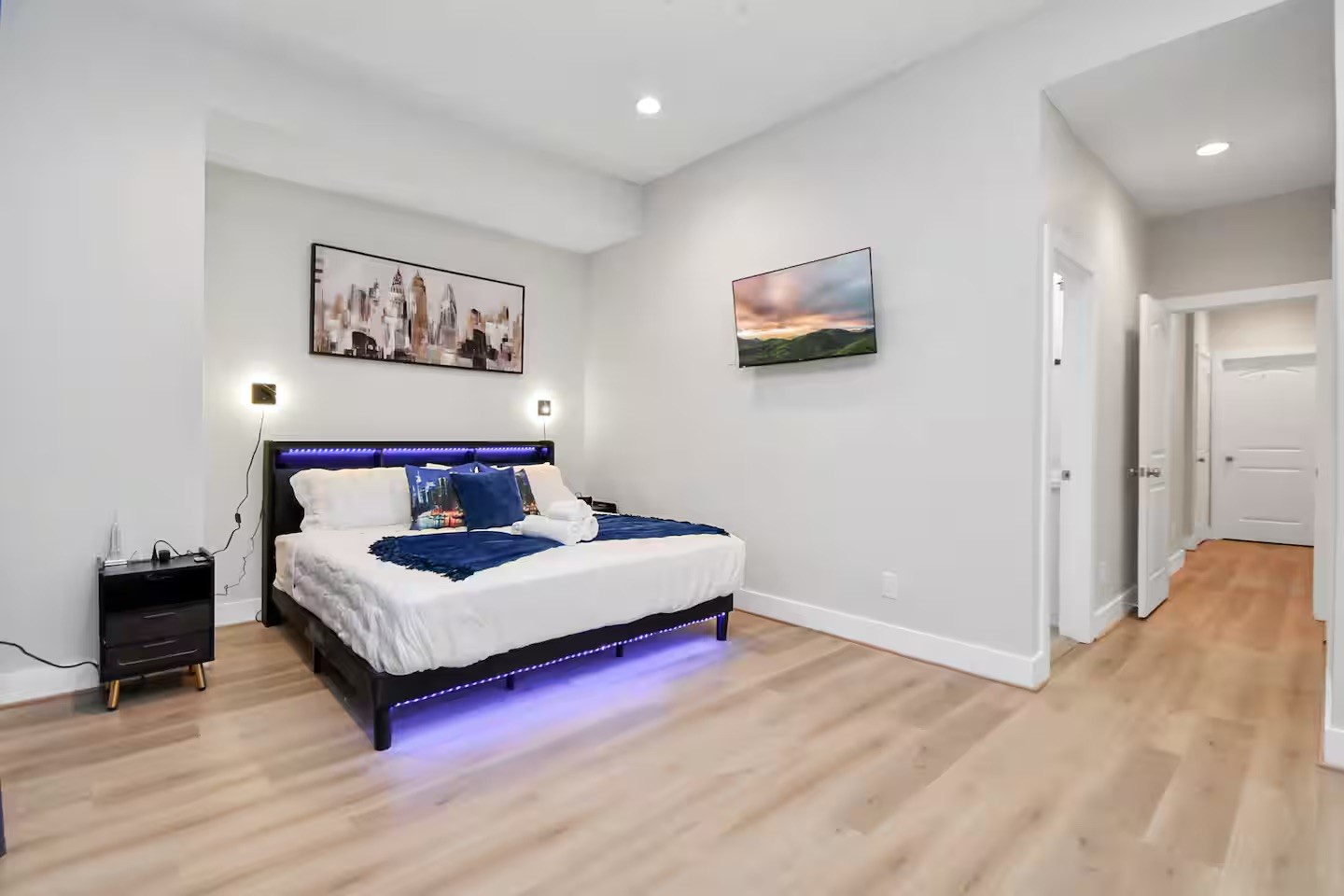 5718 Beall Street, Unit D Houston, TX 77091 - Photo 16 of 41 a spacious bedroom with a bed and wall painting