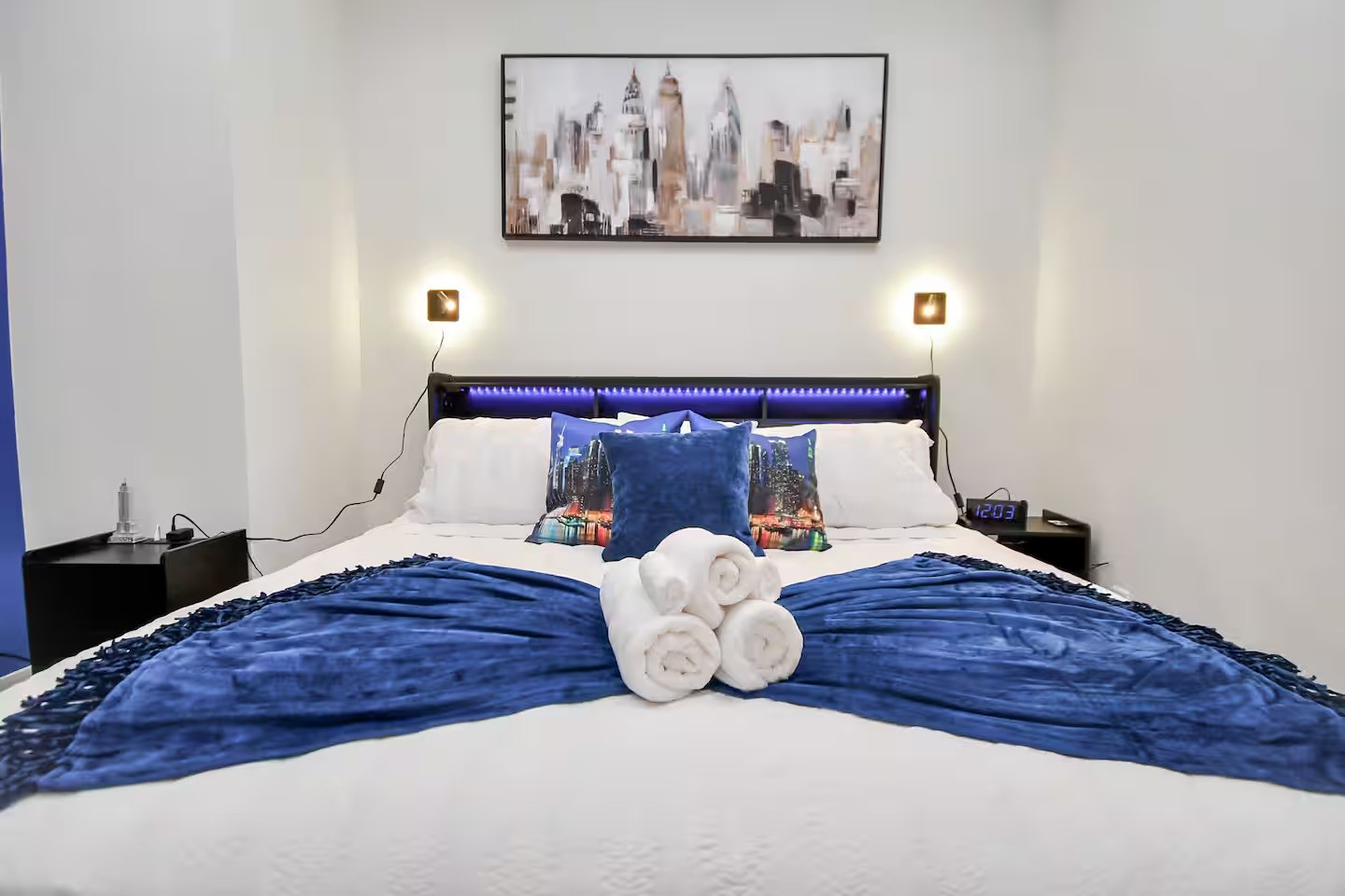 5718 Beall Street, Unit D Houston, TX 77091 - Photo 17 of 41 a bedroom with a bed and painting on the wall