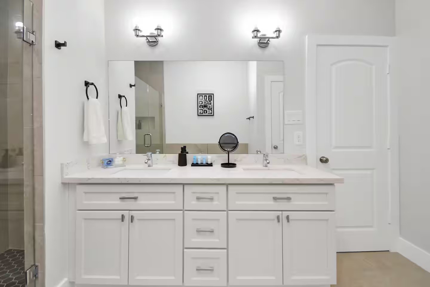 5718 Beall Street, Unit D Houston, TX 77091 - Photo 22 of 41 a bathroom with white cabinets sink and mirror