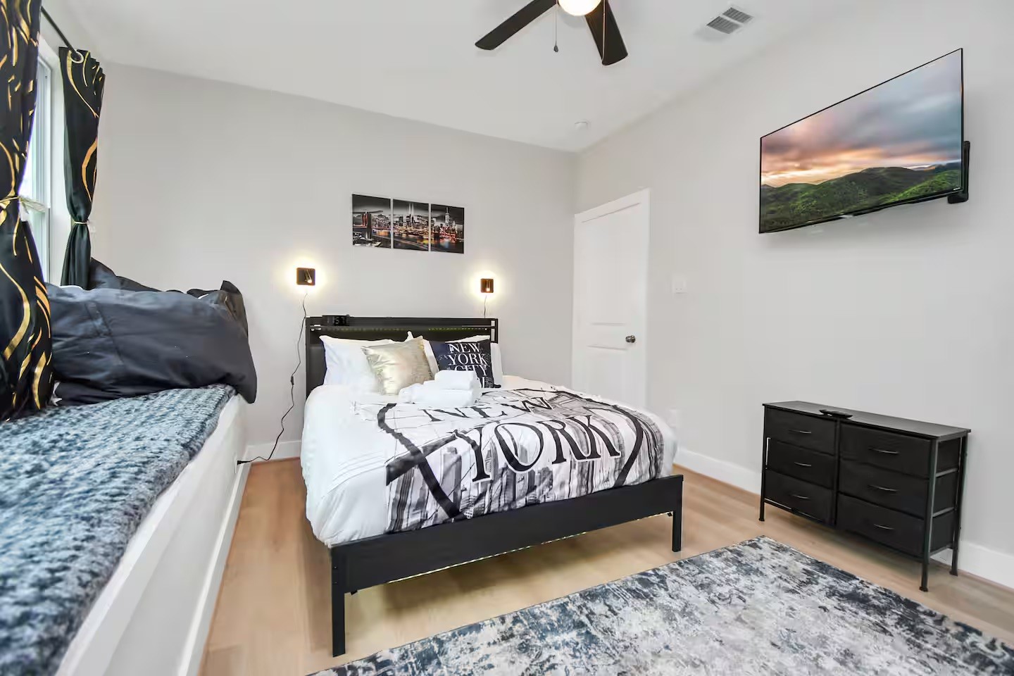 5718 Beall Street, Unit D Houston, TX 77091 - Photo 30 of 41 a bedroom with a bed and a television