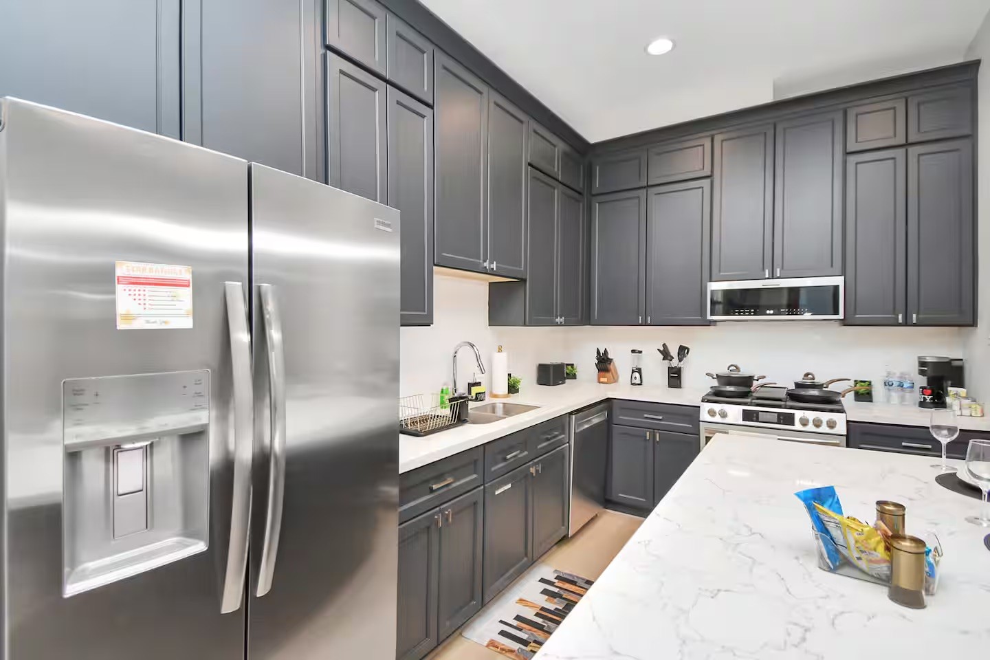 5718 Beall Street, Unit D Houston, TX 77091 - Photo 3 of 41 a kitchen with stainless steel appliances granite countertop a sink a stove and refrigerator