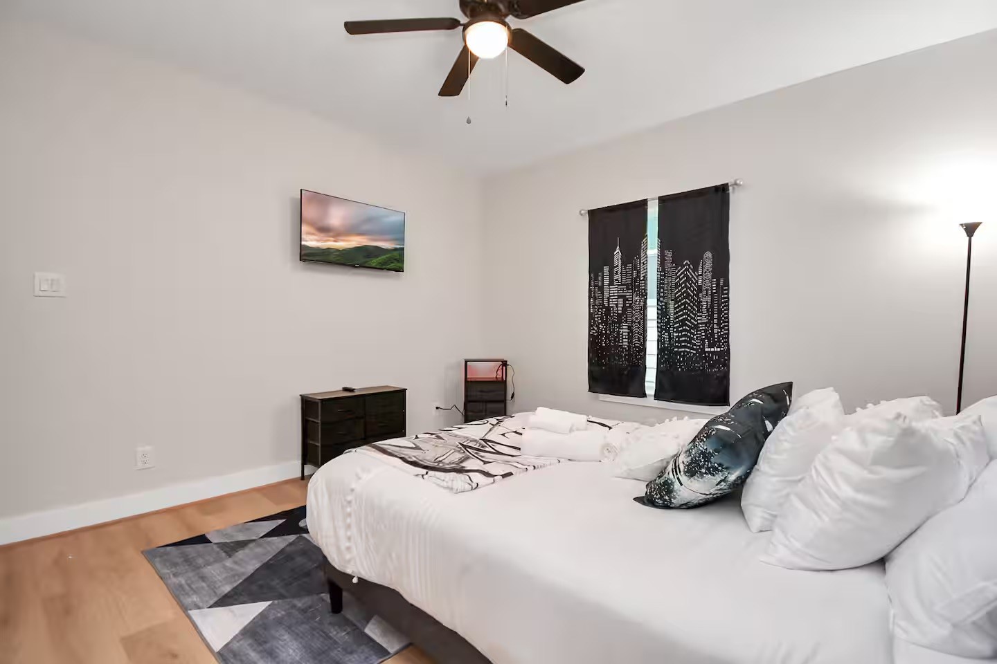 5718 Beall Street, Unit D Houston, TX 77091 - Photo 32 of 41 a bedroom with a bed and wooden floor