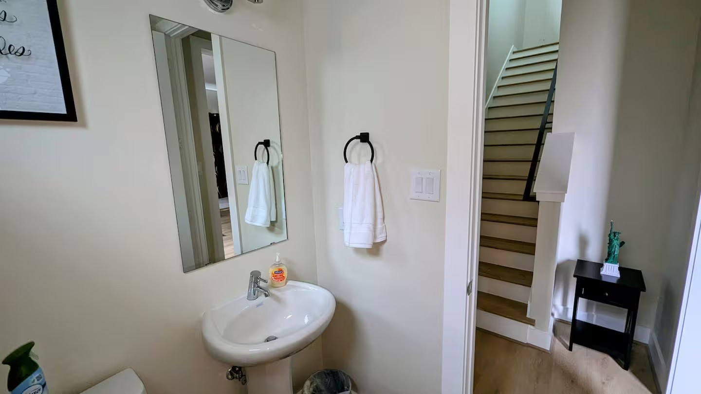 5718 Beall Street, Unit D Houston, TX 77091 - Photo 38 of 41 a bathroom with a sink and a mirror