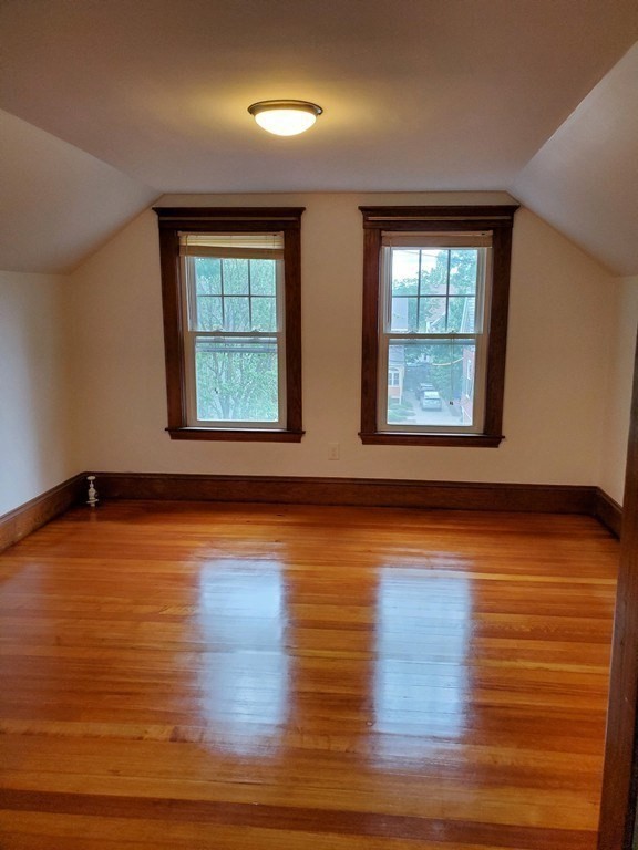 22 Allen Street, Unit 2 Arlington, MA 02474 - Photo 14 of 25 a view of an empty room with wooden floor and a window