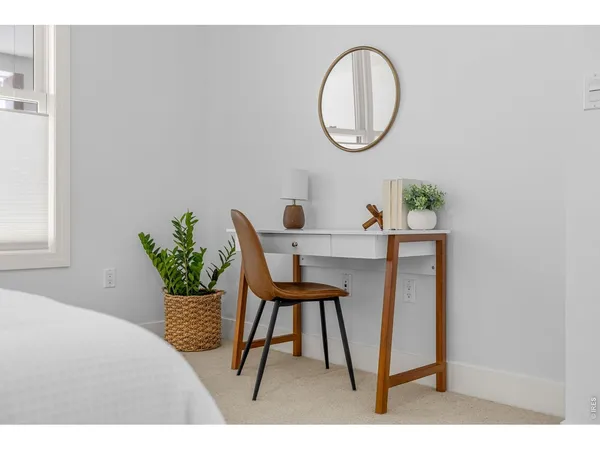 a bathroom with a granite countertop sink a toilet a mirror a vanity and shower
