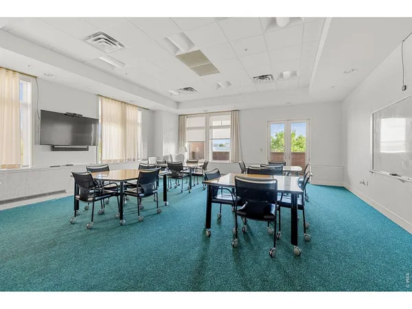 a workspace with furniture and window