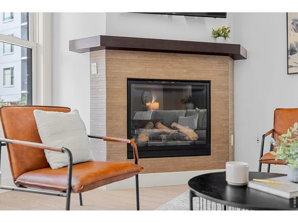 a living room with a couch and wooden floor