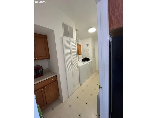 a bathroom with a shower and a sink