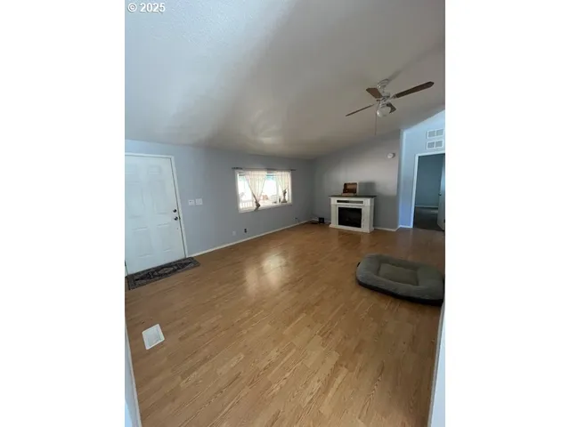 a view of a livingroom with furniture and window