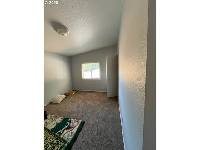 a spacious bathroom with a double vanity sink a mirror and a bathtub