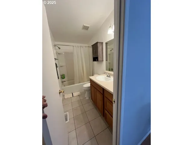 a view of a livingroom with furniture window and wooden floor