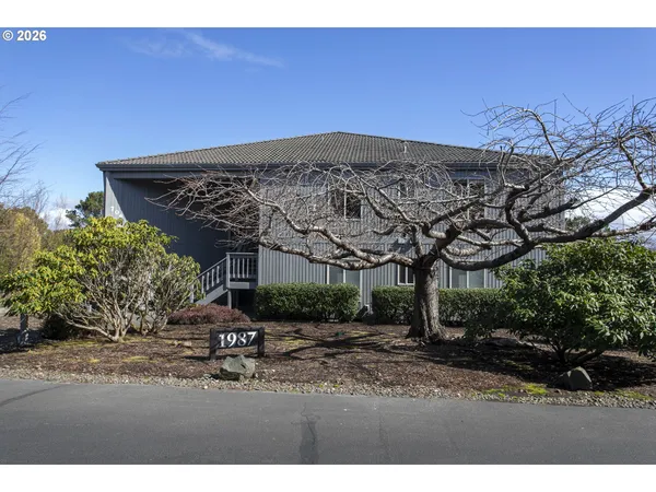 a view of a chairs and table in the patio