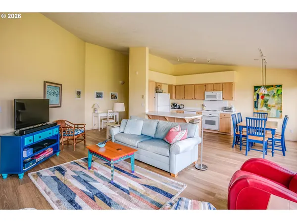 a living room with furniture a large window with yard