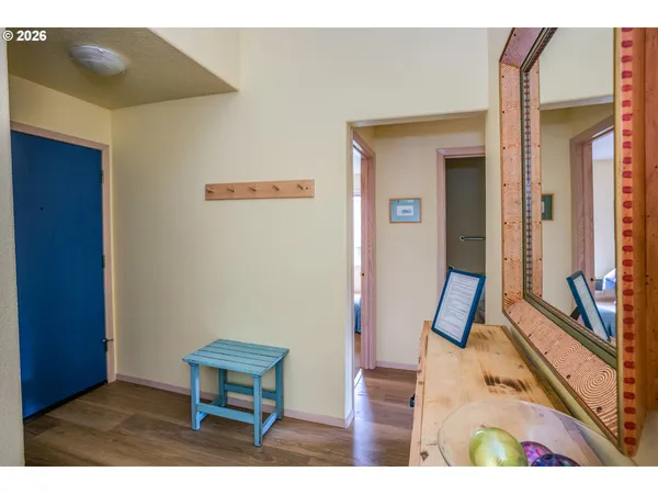 a living room with furniture large window and a fireplace