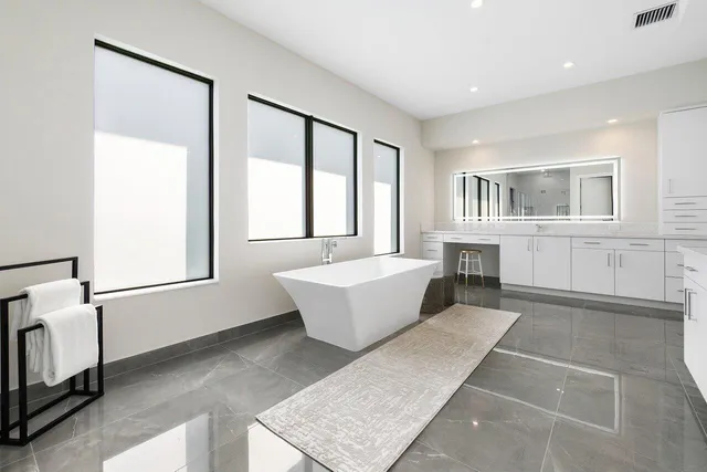 a living room with furniture and windows