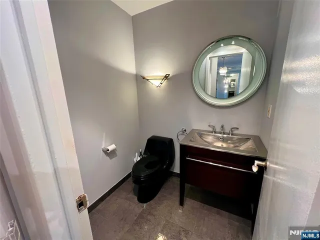 a kitchen with a sink and a stove top oven