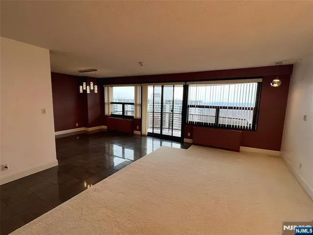 a kitchen with a sink appliances and cabinets