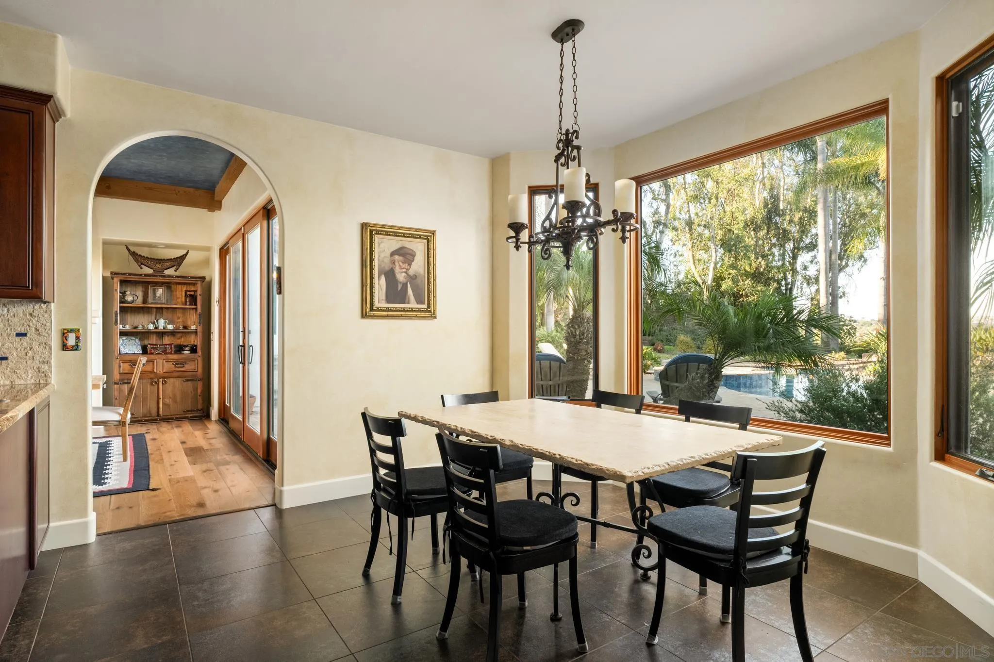 3028 Paseo Cielo Rancho Santa Fe, CA 92024 - Photo 16 of 50 a view of a dining room with furniture window and wooden floor