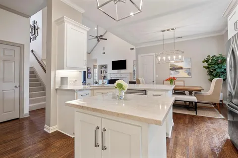 a view of kitchen with sink and living room
