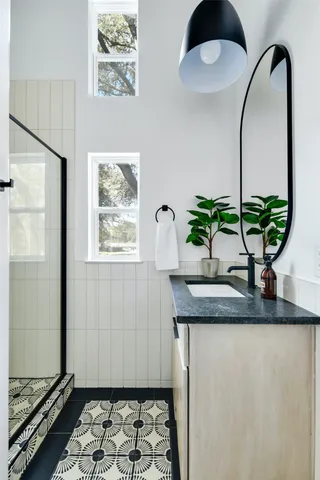 a close view of a sink and a refrigerator in the kitchen