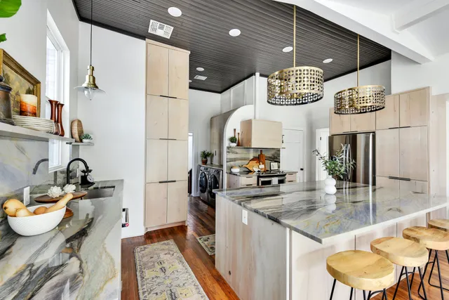 a kitchen with a table and chairs