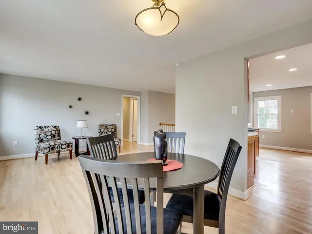 a view of a dining room with furniture and window
