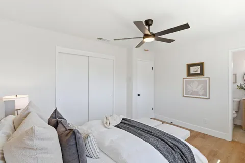 a bedroom with a bed and a window