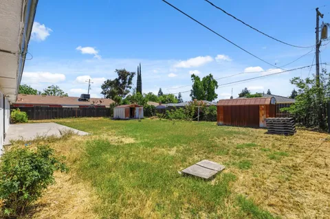 a backyard of a house with lots of green space