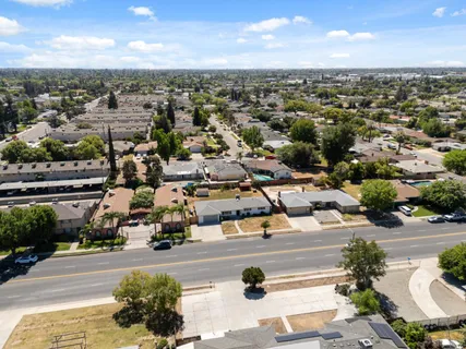 an aerial view of residential houses with outdoor space