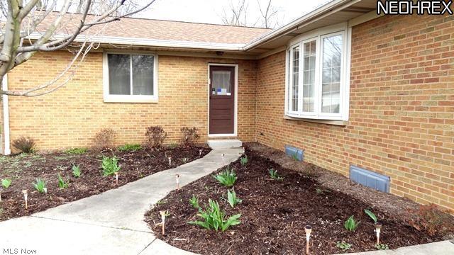 550 Overwood Road Akron, OH 44313 - Photo 21 of 22 Lovely landscaping waiting to blossom
