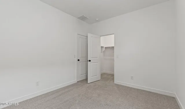 a bathroom with a double vanity sink and mirror