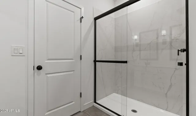 a bathroom with 2 sink and a mirror