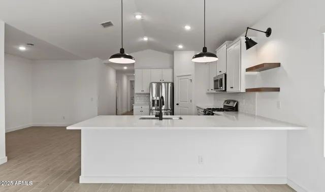 a bathroom with a sink a mirror and shower