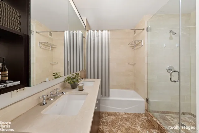 a bathroom with a tub sink and shower
